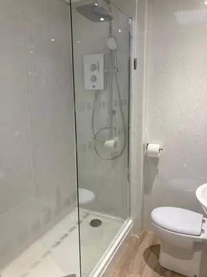 a bathroom with a shower and a toilet at Rooftops - bijou sister apartment to Assembly View - free parking permit provided in Ludlow