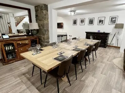 a large dining room with a long table and chairs at Converted barn, perfect MTB break, Coed y Brenin in Trawsfynydd