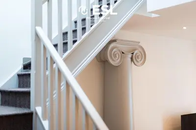 a staircase with a white rail and a stair case at Dashing 2 Bedroom Duplex Apartment, Free Parking in Shrewsbury