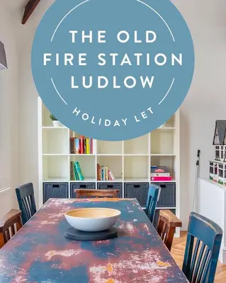 a dining room with a table with a bowl on it at The Old Fire Station Ludlow in Ludlow