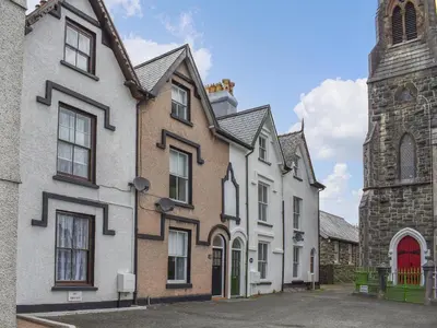 a group of buildings next to a church at Ty Ni in Bala