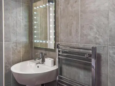 a bathroom with a sink and a mirror at Ty Ni in Bala