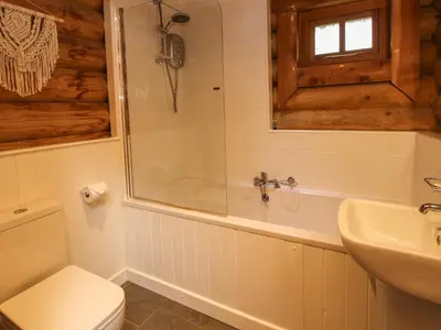 a bathroom with a tub and a toilet and a sink at Brynallt Country Park in Ellesmere