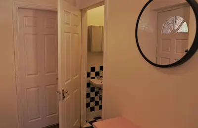 a bathroom with a mirror and a sink at Meadow Terrace in Shrewsbury