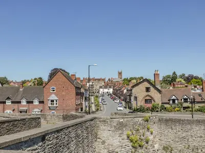 a view of a town from a stone wall at 138C Old Star and Garter Mews in Ludlow