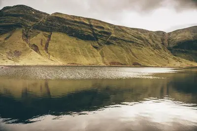 a mountain reflecting in a body of water at 3 Bed in Bethlehem oc-waw219 in Llangadog