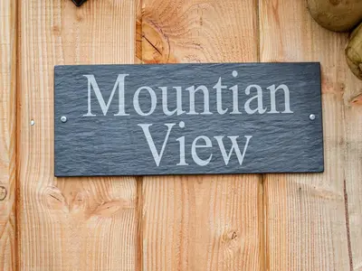 a sign that says mountain view on a wooden wall at Mountain View - Uk34179 in Cilycwm