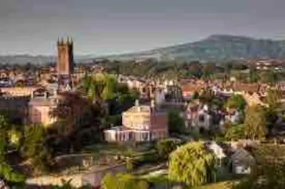 a view of a city with buildings and trees at The Nest, central Ludlow one bed apartment in Ludlow