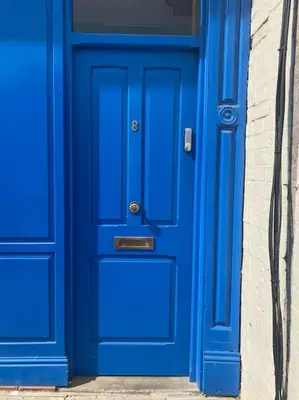 a blue door in front of a building at The Nest, central Ludlow one bed apartment in Ludlow