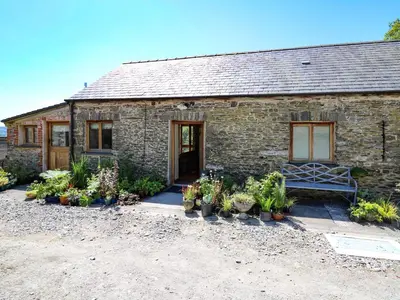 a brick house with plants in front of it at Golwg Las in Llanwrda