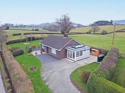 an overhead view of a small house in a field at Berwyn View in Welshpool