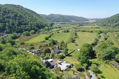 an aerial view of a village in the hills at Ty Canol Maentwrog, Snowdonia Nr Zip World in Maentwrog