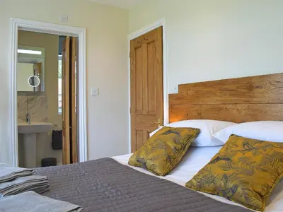 a bed with two pillows on it in a bedroom at Barnleigh in Ludlow