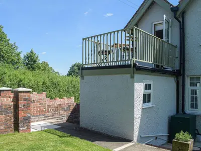a balcony on the side of a house at Barnleigh in Ludlow