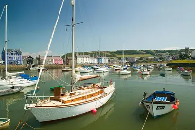 a group of boats are docked in a harbor at 3 Bed in Aberaeron oc-bow330 in Ciliau-Aeron