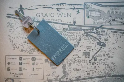 a key on top of a map with a tag at Empress En Suite Wagon in Arthog