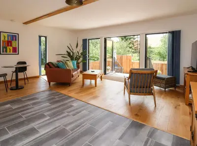 a living room with a couch and a table at No1 The Lodge in Bishops Castle