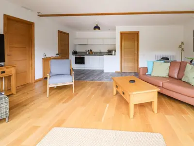 a living room with a couch and a table at No1 The Lodge in Bishops Castle