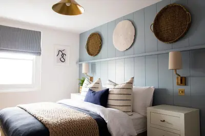 a bedroom with a bed with pillows on it at Salthouse apartment in Aberaeron