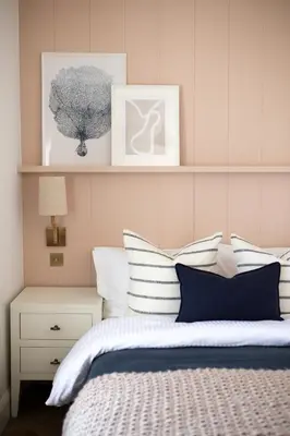 a bedroom with a bed with white and blue pillows at Morahan apartment in Aberaeron