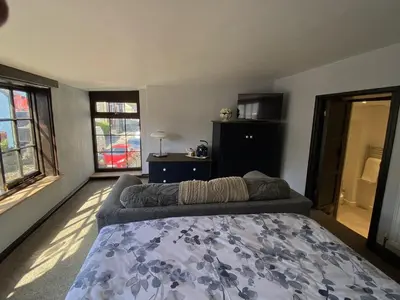 a bedroom with a bed and a couch at Tom's of Tregaron in Tregaron