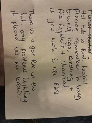 a handwritten handwriting on a piece of paper at Four seasons with wood fuel hot tub Country retreat in Hereford