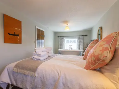 a bedroom with a bed with pillows on it at Turford House in Ludlow