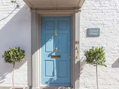a blue door on a white brick house at Turford House in Ludlow