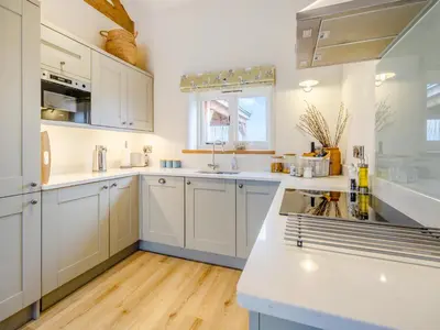 a kitchen with white cabinets and a white counter top at Pheasants Folly - Uk33955 in Llanymynech