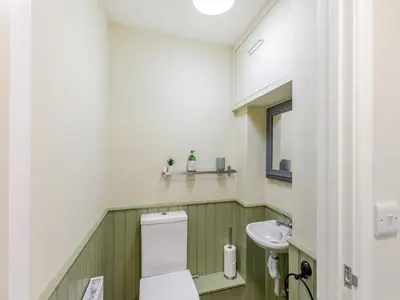 a bathroom with a white toilet and a sink at The Cottage-Uk37339 in Montgomery