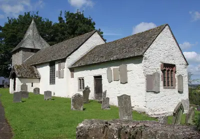 an old church with graves in front of it at A cottage for two in Brecon