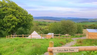 a wooden fence with a sign that reads canyon ball trait at Calon Y Goedwig Glamping in Llandovery