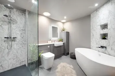 a bathroom with a tub and a toilet and a sink at 3 Bed in Trawsfynydd oc-wag718 in Trawsfynydd