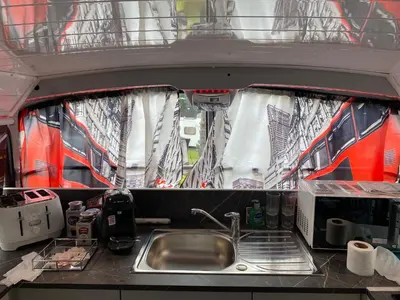 a kitchen in a rv with a sink and a sink at Double Decker Bus in Aberystwyth
