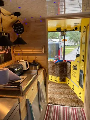 a view of a kitchen in a rv with a window at Double Decker Bus in Aberystwyth