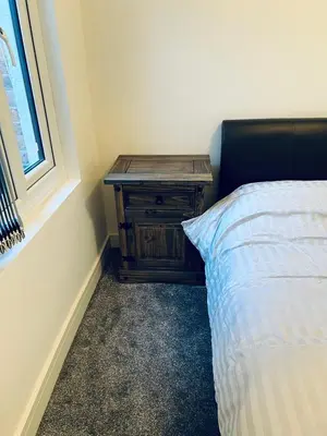 a bedroom with a bed and a table next to a window at 21 ,North Street in Shrewsbury