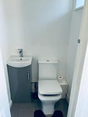 a bathroom with a white toilet and a sink at 21 ,North Street in Shrewsbury