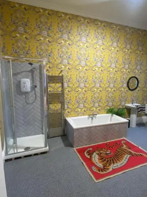 a bathroom with a shower and a tub and a sink at Cader en suite at Pen Y Coed Hall exclusive Luxury Hot Tub in Dolgellau