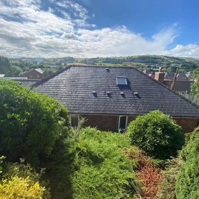 a roof of a house with bushes in front of it at Luxury 4-5 Bed Home with Games Room and Balcony in Newtown