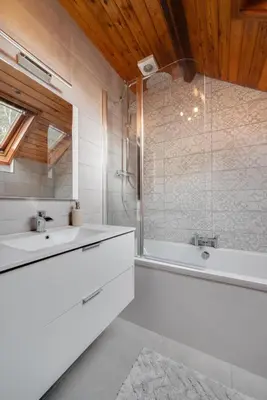 a bathroom with two sinks and a bath tub at 3 Bed in Aberaeron oc-bow315 in Cross Inn