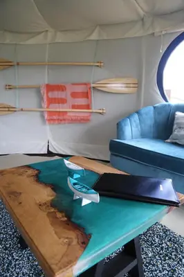 a living room with a table and a couch at Heart of the Wye in Clifford