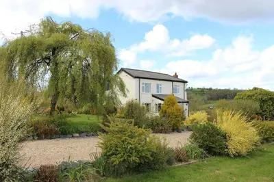 a house in the middle of a garden at Country Home with Gardens in Newtown