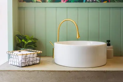 a white sink with a faucet on a counter at Loft Fach in Tregaron