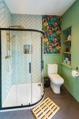 a bathroom with a shower and a toilet at Loft Fach in Tregaron
