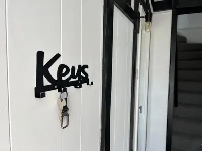 a door with a keys sign on it at Escapism Wales Gwalia in Llanrhystyd