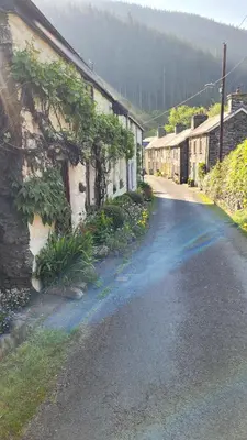 an empty street in a small village with houses at The Granary Corris on the edge of the Dyfi Forest in Corris