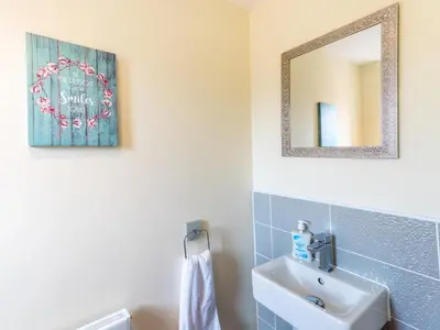 a bathroom with a sink and a mirror at Stylish modern two bedroom home in Shrewsbury - Pass the Keys in Shrewsbury
