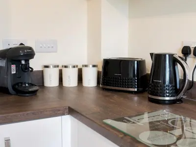 a counter top with a coffee maker and a toaster at Stylish modern two bedroom home in Shrewsbury - Pass the Keys in Shrewsbury