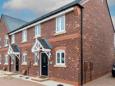 a red brick building with a black roof at Stylish modern two bedroom home in Shrewsbury - Pass the Keys in Shrewsbury