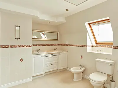 a bathroom with a toilet and a sink at Luxury 5 bedroom Riverside home in town centre - Pass the Keys in Shrewsbury